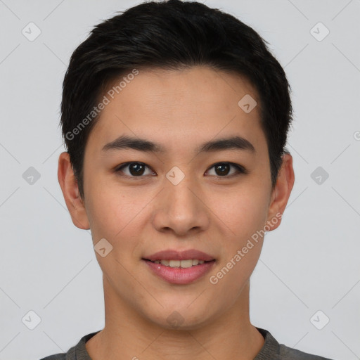 Joyful asian young-adult male with short  brown hair and brown eyes