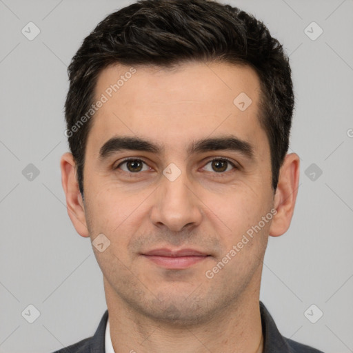 Joyful white young-adult male with short  black hair and brown eyes