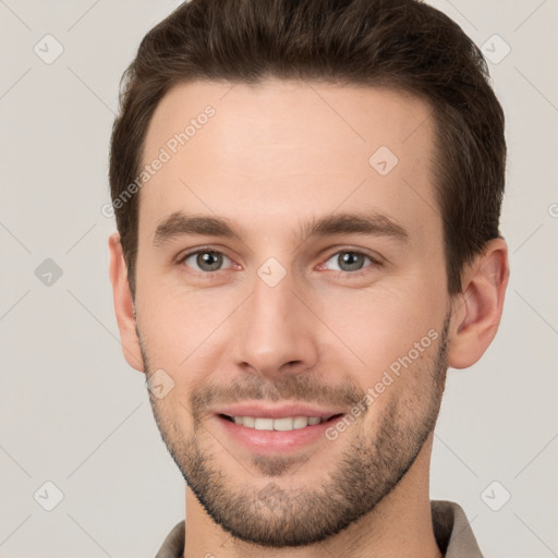 Joyful white young-adult male with short  brown hair and brown eyes