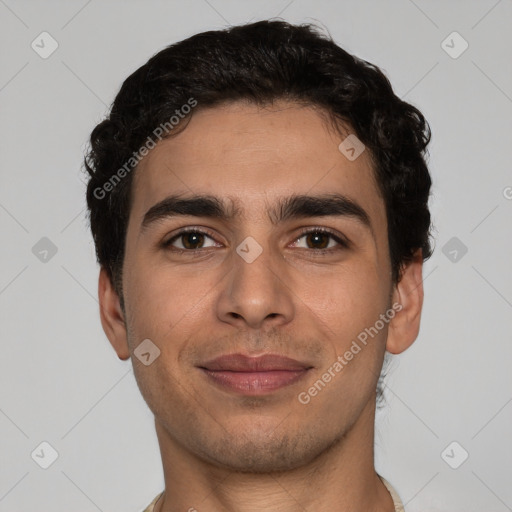 Joyful white young-adult male with short  black hair and brown eyes