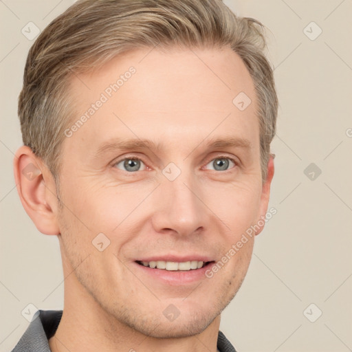 Joyful white adult male with short  brown hair and grey eyes