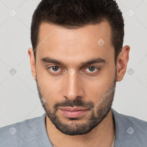 Neutral white young-adult male with short  brown hair and brown eyes