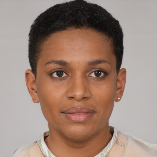 Joyful black young-adult female with short  brown hair and brown eyes