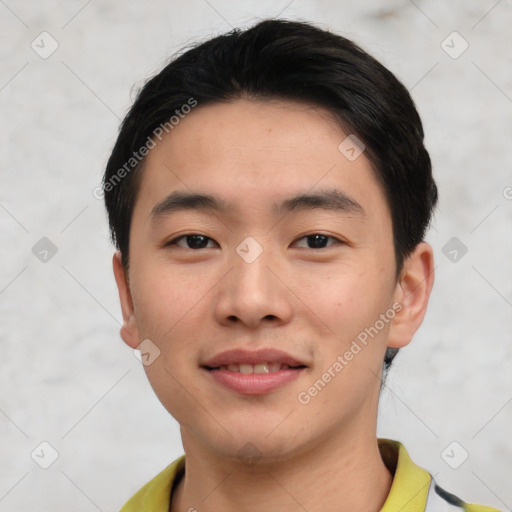 Joyful asian young-adult male with short  black hair and brown eyes