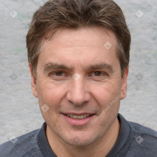 Joyful white adult male with short  brown hair and grey eyes