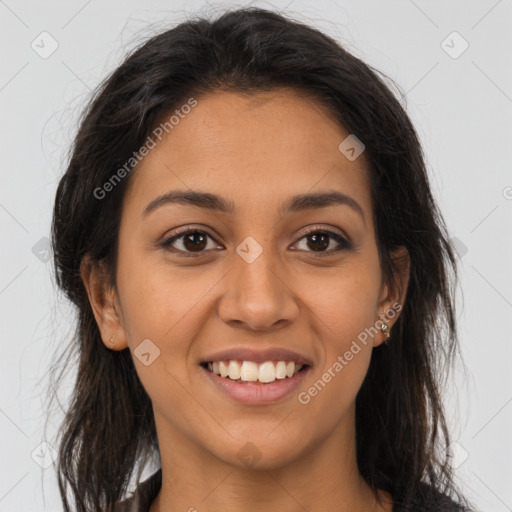 Joyful latino young-adult female with long  brown hair and brown eyes