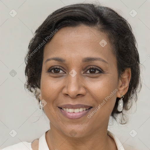 Joyful black adult female with medium  brown hair and brown eyes