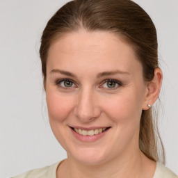 Joyful white young-adult female with medium  brown hair and grey eyes