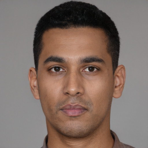 Neutral latino young-adult male with short  black hair and brown eyes