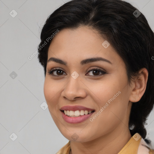 Joyful latino young-adult female with medium  brown hair and brown eyes