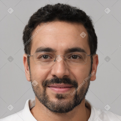 Joyful white adult male with short  black hair and brown eyes