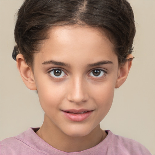 Joyful white child female with short  brown hair and brown eyes