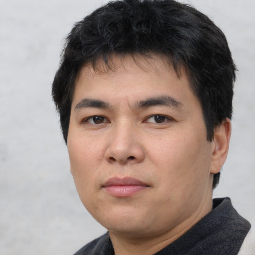 Neutral asian young-adult male with short  brown hair and brown eyes