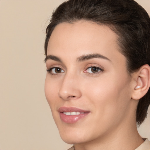 Joyful white young-adult female with medium  brown hair and brown eyes