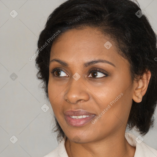 Joyful black young-adult female with medium  brown hair and brown eyes