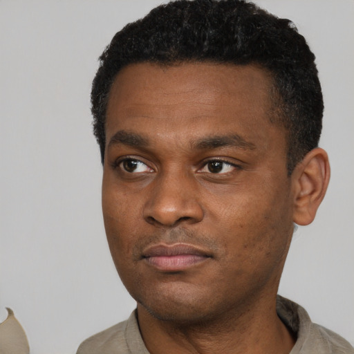 Neutral black young-adult male with short  black hair and brown eyes