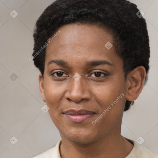 Joyful black young-adult female with short  black hair and brown eyes