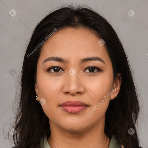 Joyful latino young-adult female with long  brown hair and brown eyes