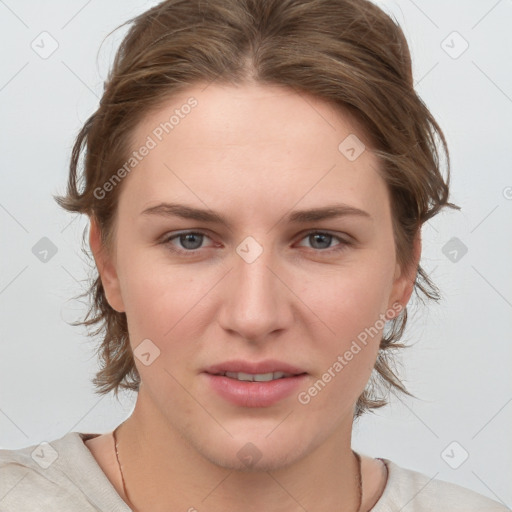 Joyful white young-adult female with medium  brown hair and blue eyes