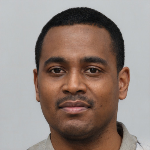 Neutral black young-adult male with short  black hair and brown eyes