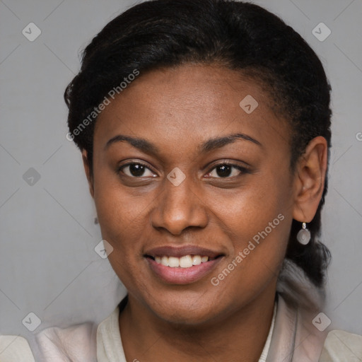 Joyful black young-adult female with short  brown hair and brown eyes