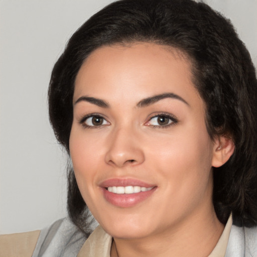 Joyful white young-adult female with medium  black hair and brown eyes