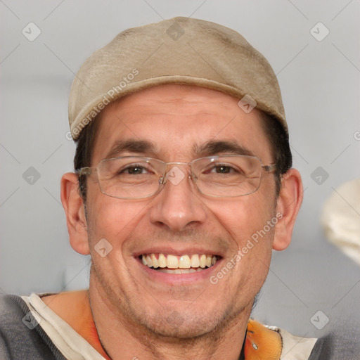 Joyful white adult male with short  brown hair and brown eyes