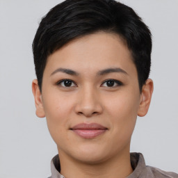 Joyful asian young-adult female with short  black hair and brown eyes