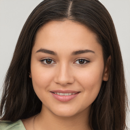 Joyful white young-adult female with long  brown hair and brown eyes