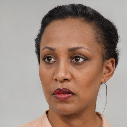 Neutral black adult female with short  brown hair and brown eyes