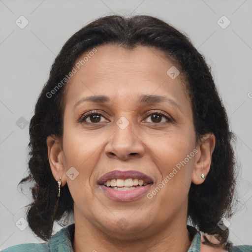 Joyful latino adult female with medium  brown hair and brown eyes