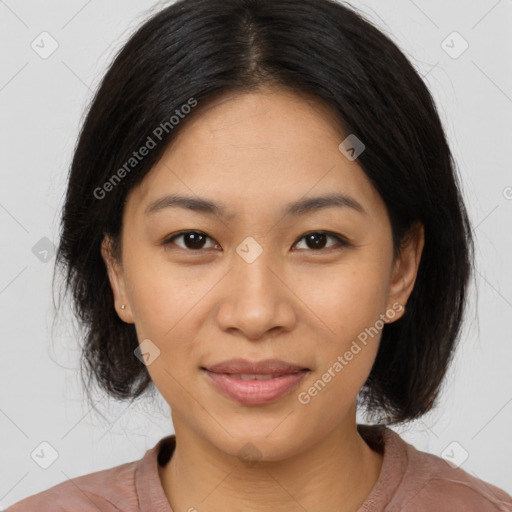 Joyful asian young-adult female with medium  black hair and brown eyes