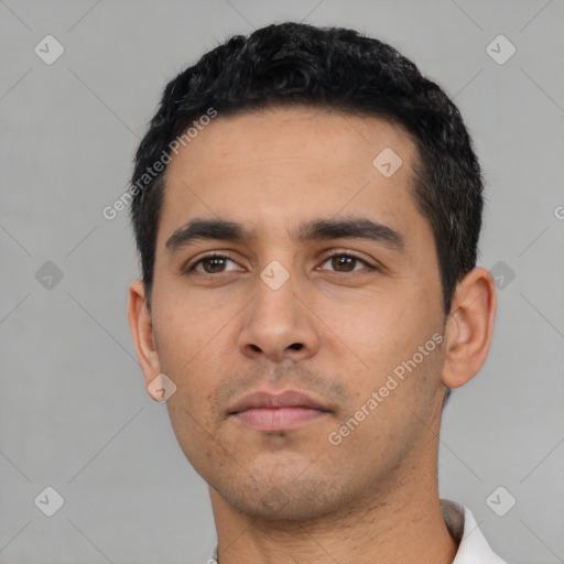 Neutral latino young-adult male with short  black hair and brown eyes
