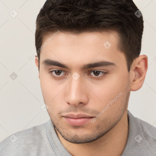 Neutral white young-adult male with short  brown hair and brown eyes