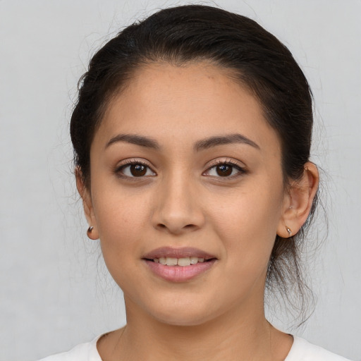 Joyful white young-adult female with medium  brown hair and brown eyes