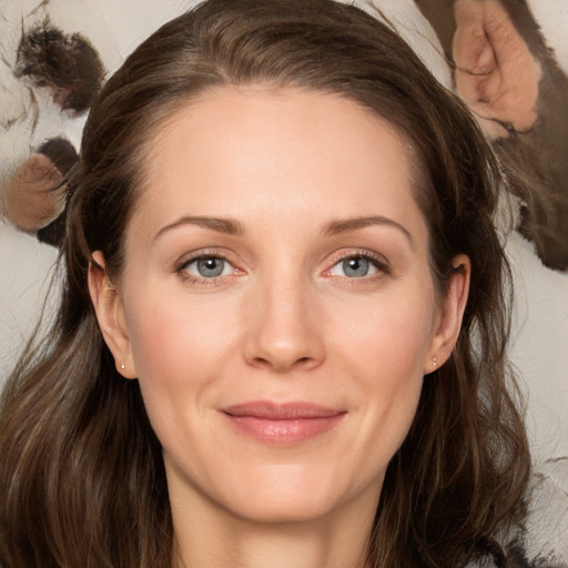 Joyful white adult female with long  brown hair and brown eyes