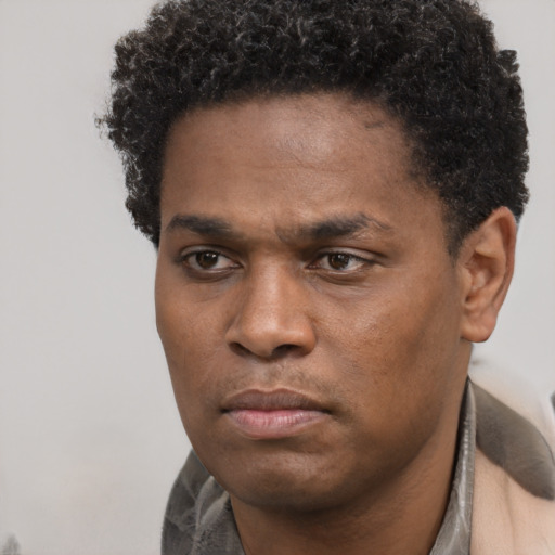 Neutral black young-adult male with short  brown hair and brown eyes