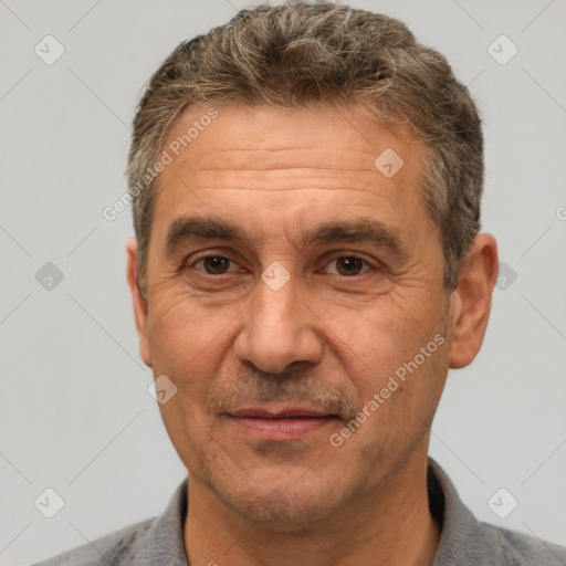 Joyful white middle-aged male with short  brown hair and brown eyes