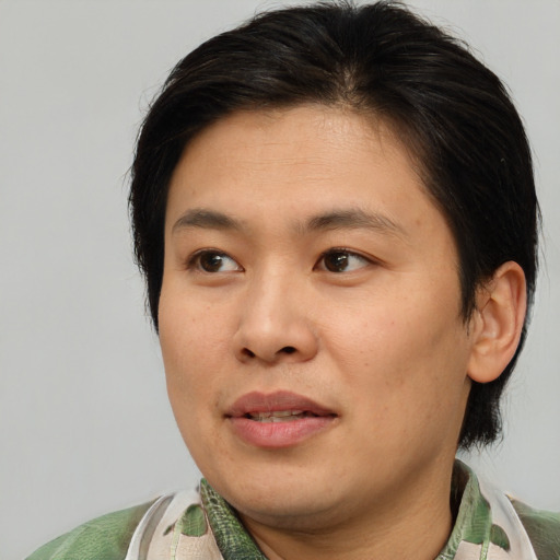 Neutral asian young-adult male with medium  brown hair and brown eyes
