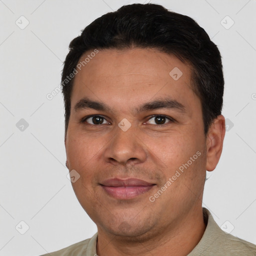 Joyful white young-adult male with short  black hair and brown eyes