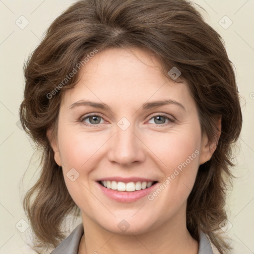 Joyful white young-adult female with medium  brown hair and green eyes