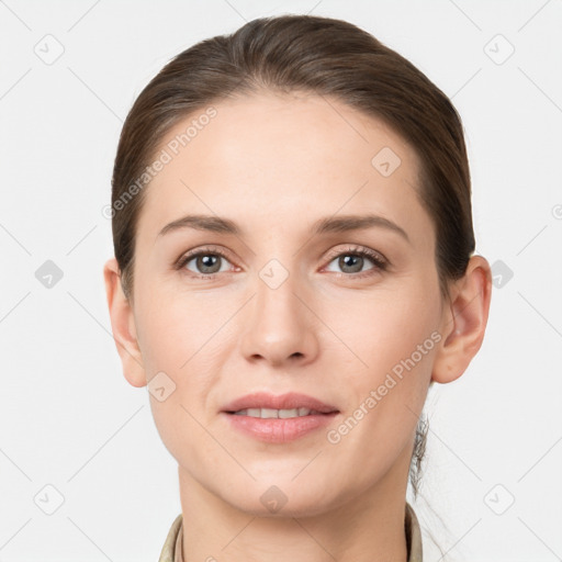 Joyful white young-adult female with short  brown hair and grey eyes