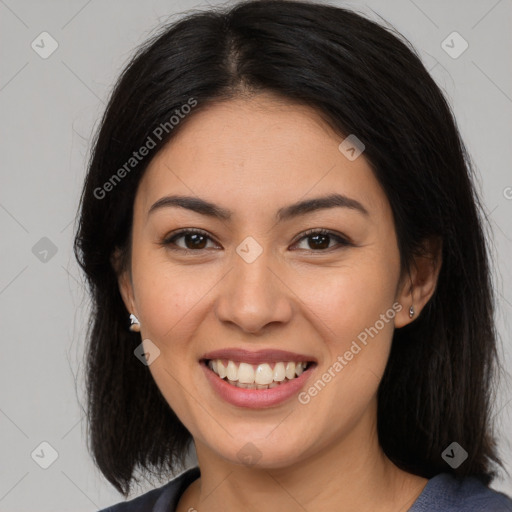 Joyful asian young-adult female with long  brown hair and brown eyes