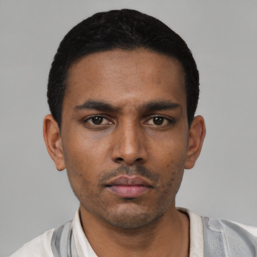 Neutral latino young-adult male with short  black hair and brown eyes