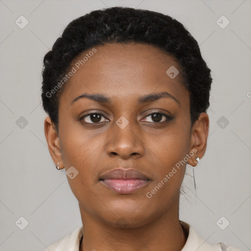 Joyful black young-adult female with short  black hair and brown eyes