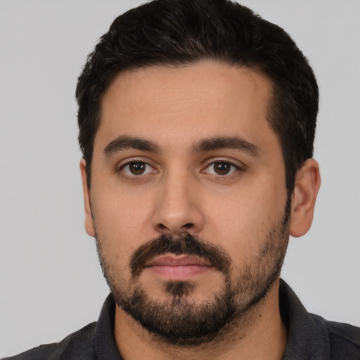 Neutral white young-adult male with short  black hair and brown eyes