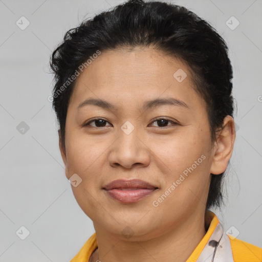 Joyful latino young-adult female with short  brown hair and brown eyes