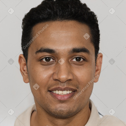 Joyful black young-adult male with short  black hair and brown eyes