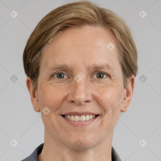 Joyful white adult female with short  brown hair and grey eyes