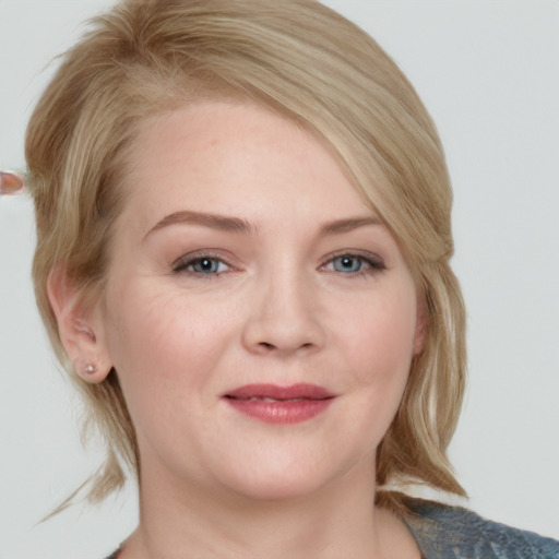 Joyful white young-adult female with medium  blond hair and blue eyes